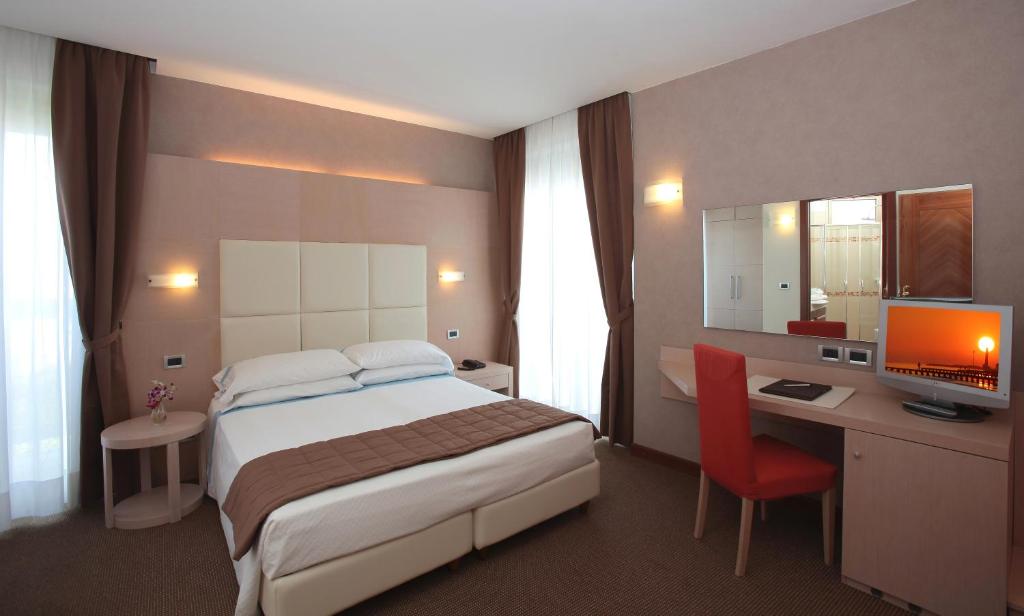 Cama o camas de una habitación en Hotel Rivamare