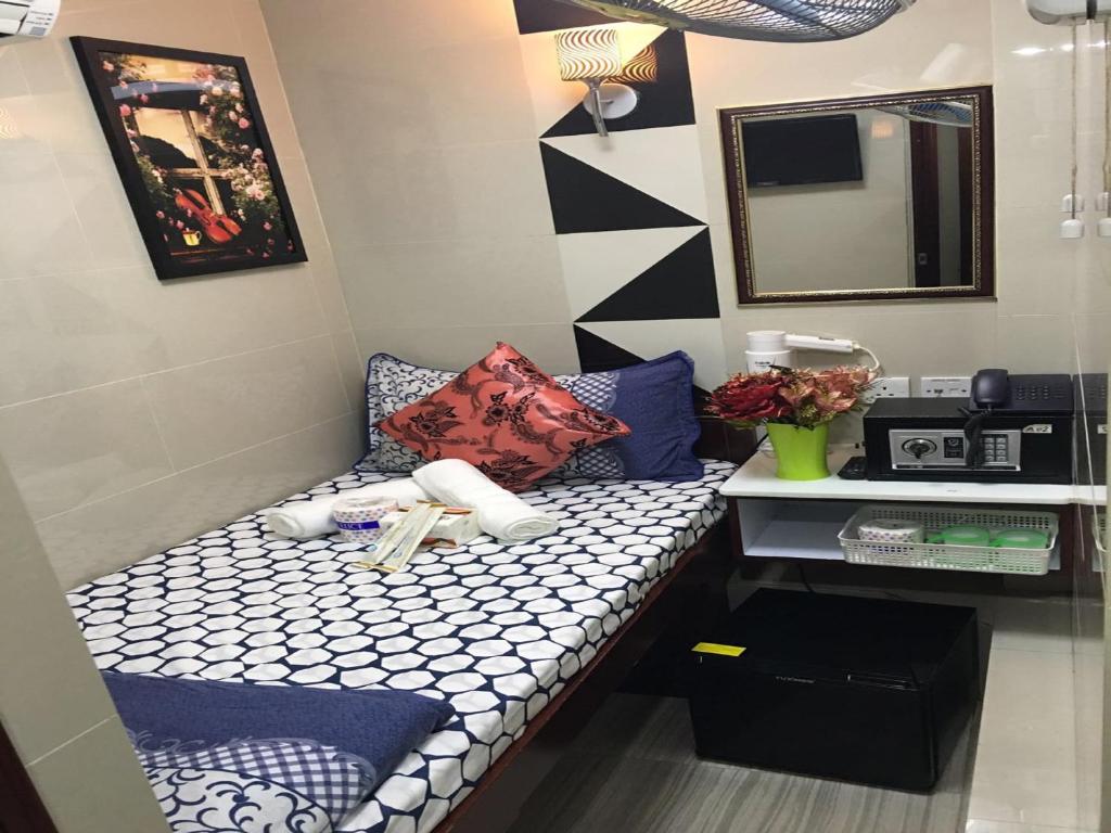 Postel nebo postele na pokoji v ubytování Rich Hostel