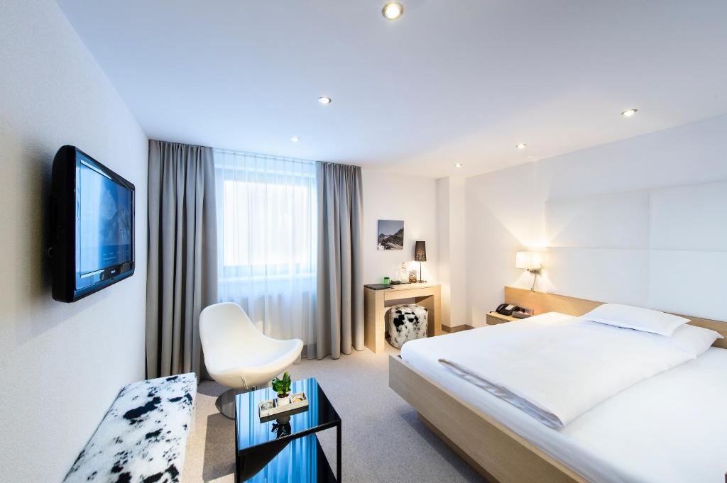 Postel nebo postele na pokoji v ubytování Hotel Rössle Superior