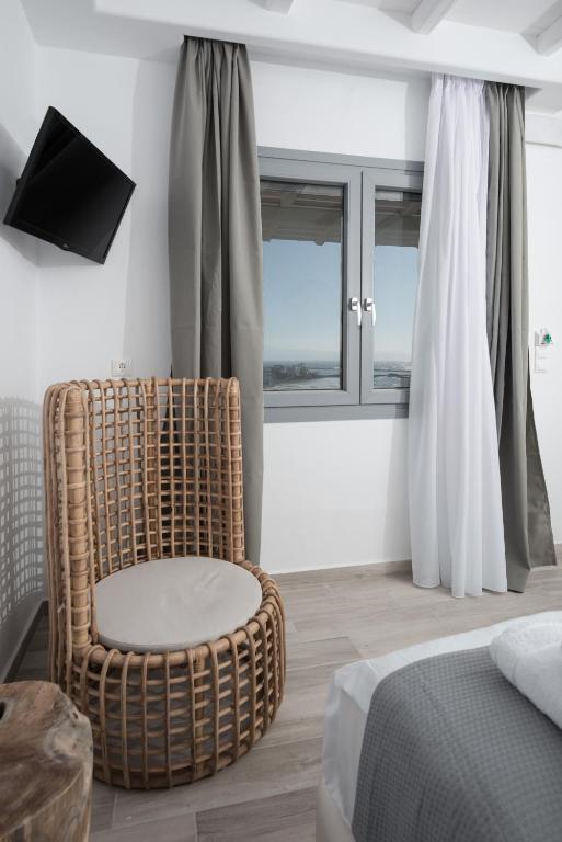 Postel nebo postele na pokoji v ubytování Iliada Suites