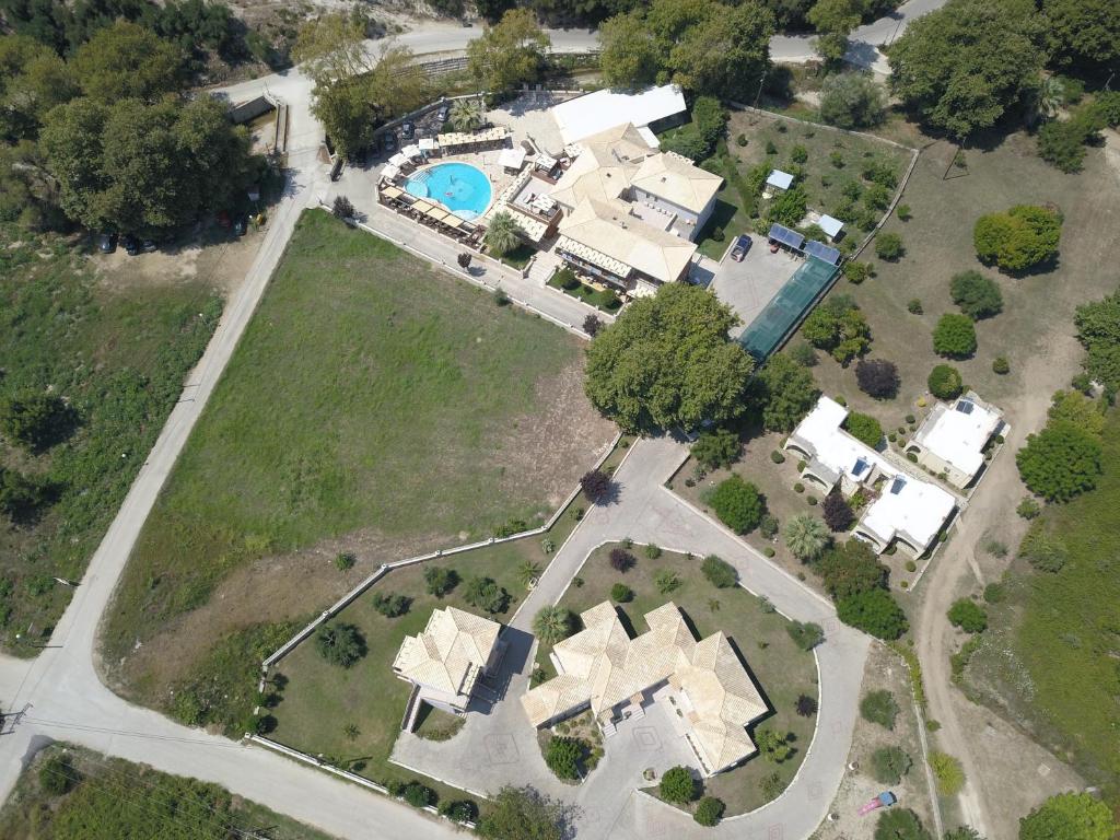 an aerial view of a house with a pool at Riviera Perdika Hotel in Perdika