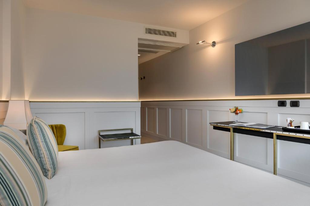Postel nebo postele na pokoji v ubytování Savoia Hotel Rimini
