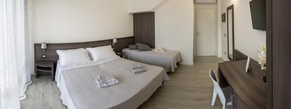 Postel nebo postele na pokoji v ubytování Il mare di Giulia