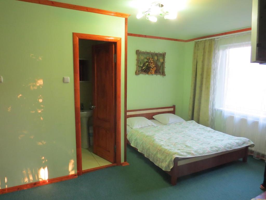 Postel nebo postele na pokoji v ubytování Вишиванка
