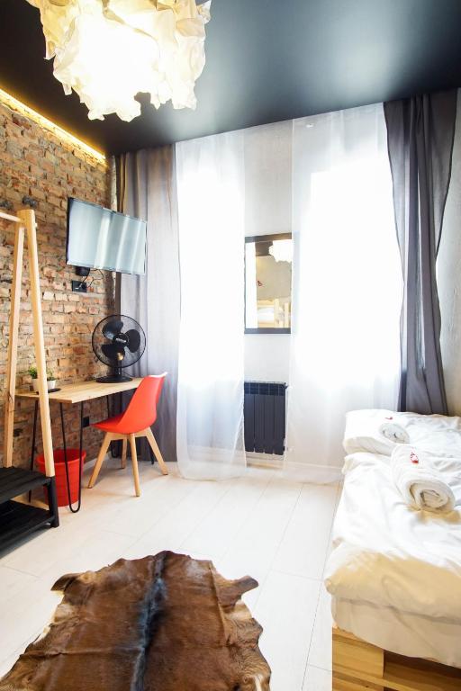 Postel nebo postele na pokoji v ubytování Retro Apartments