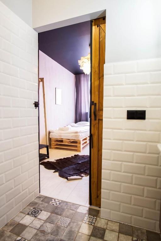 Postel nebo postele na pokoji v ubytování Retro Apartments