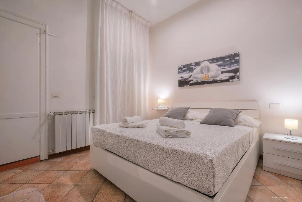 Posteľ alebo postele v izbe v ubytovaní Wine Apartments Florence Moscato