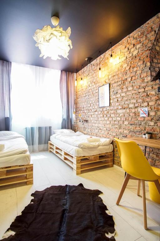 Postel nebo postele na pokoji v ubytování Retro Apartments