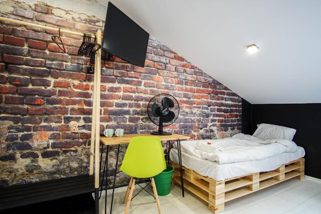 Postel nebo postele na pokoji v ubytování Retro Apartments