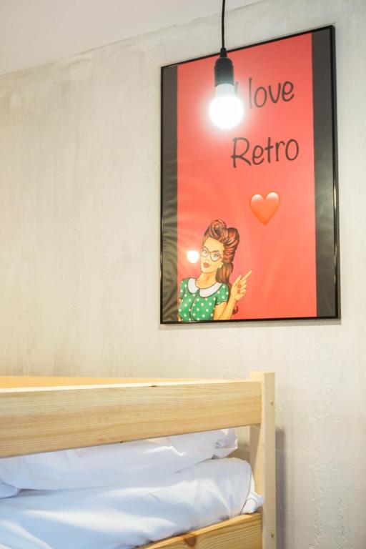 Postel nebo postele na pokoji v ubytování Retro Apartments