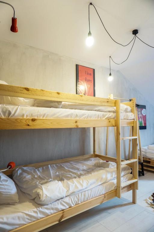 Postel nebo postele na pokoji v ubytování Retro Apartments