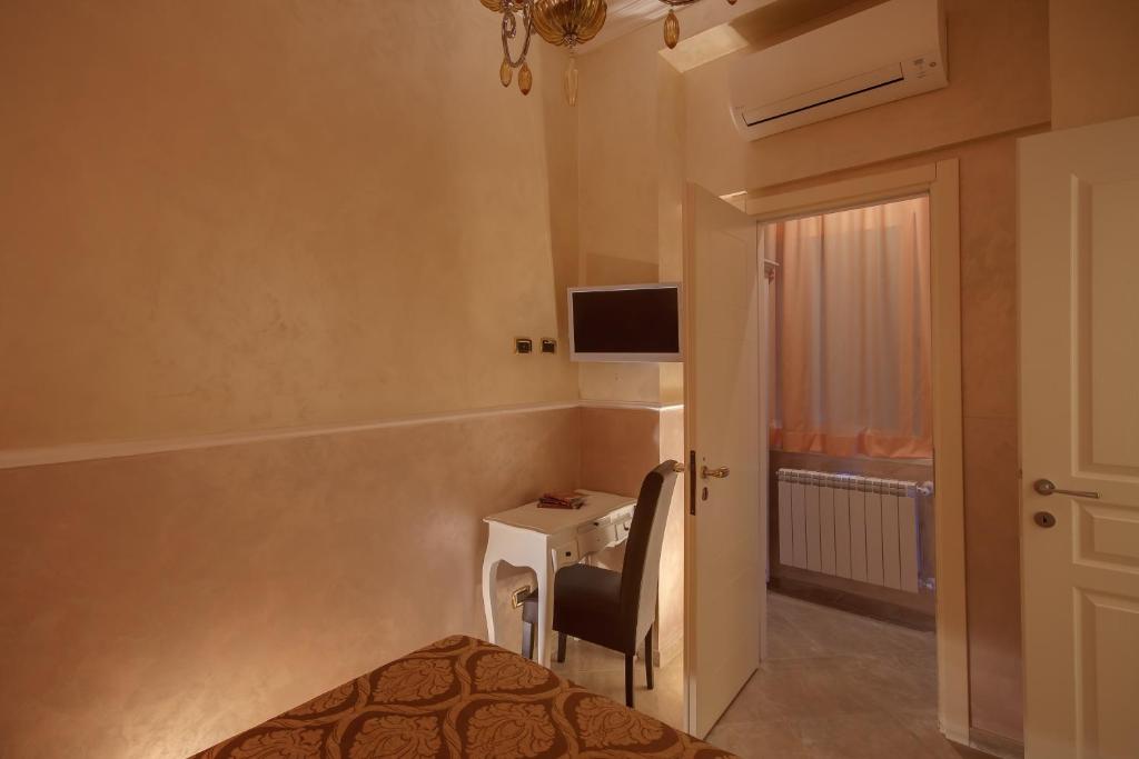 Televízia a/alebo spoločenská miestnosť v ubytovaní Quality in Rome