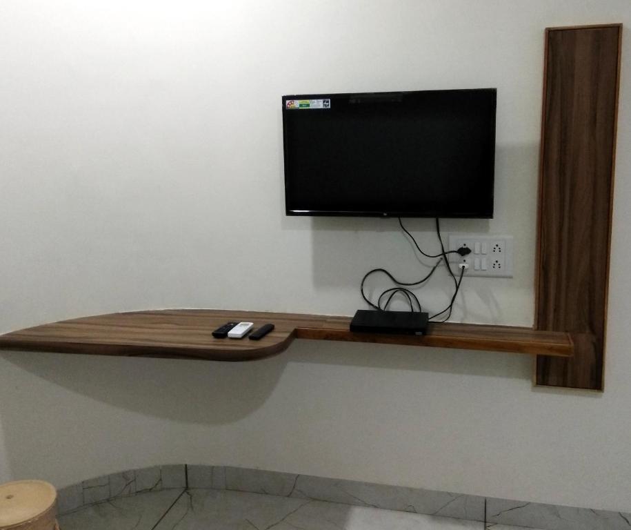 TV a/nebo společenská místnost v ubytování Hotel Milan