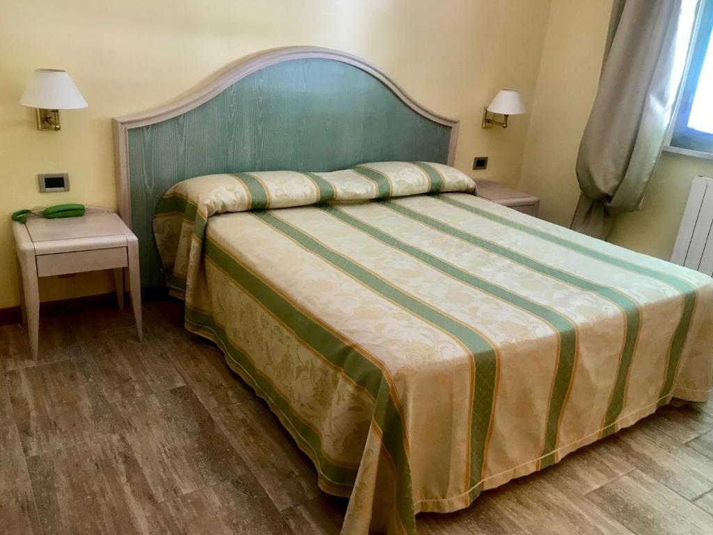 Postel nebo postele na pokoji v ubytování Hotel Siesta