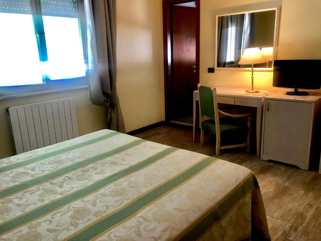 Postel nebo postele na pokoji v ubytování Hotel Siesta