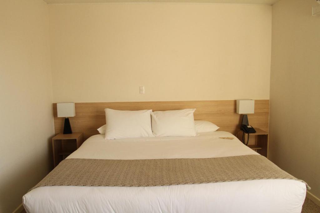Postel nebo postele na pokoji v ubytování Hotel Umawue