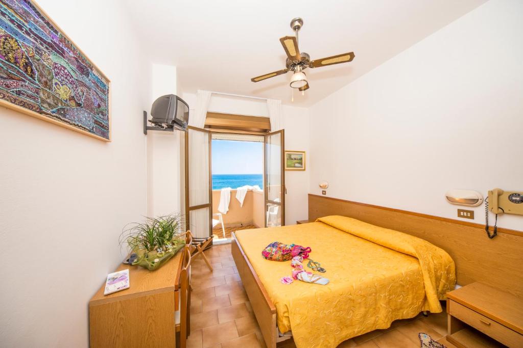 Postel nebo postele na pokoji v ubytování Hotel Touring