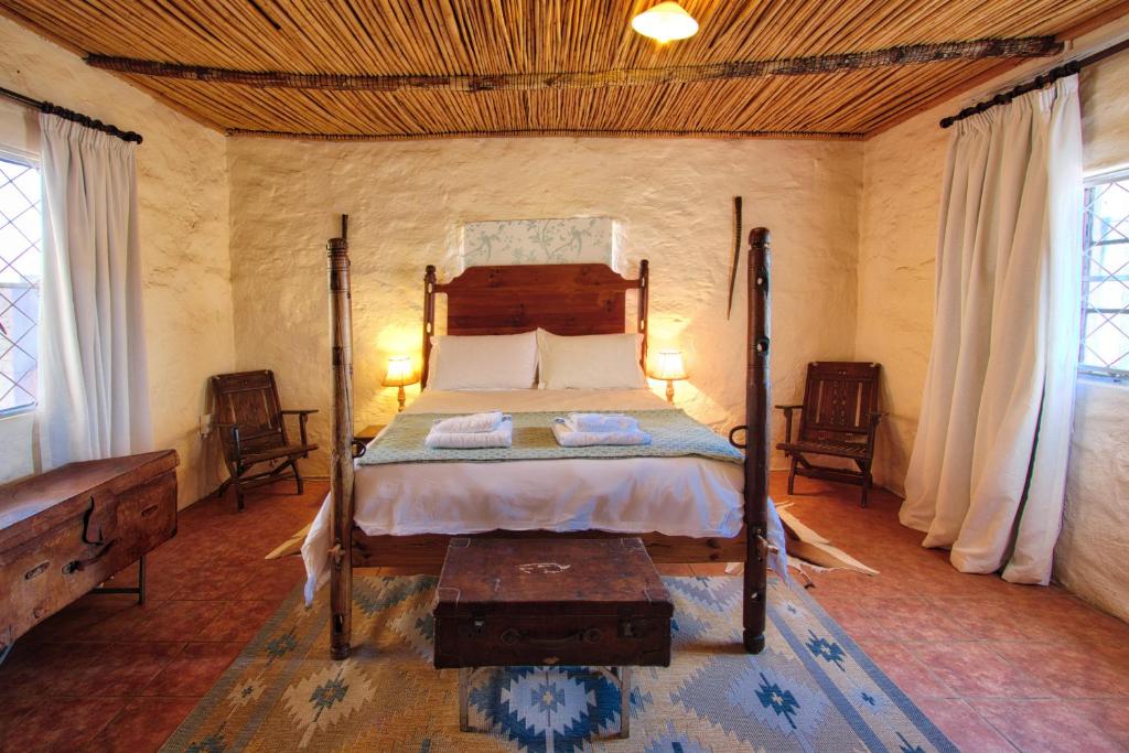 Ένα ή περισσότερα κρεβάτια σε δωμάτιο στο Ironstone Cottage