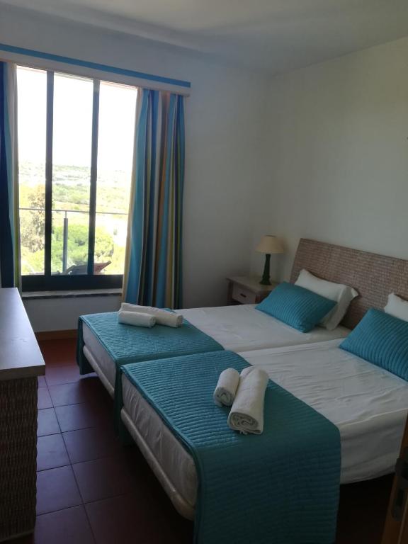 Postel nebo postele na pokoji v ubytování Residence Golf Club, Vilamoura