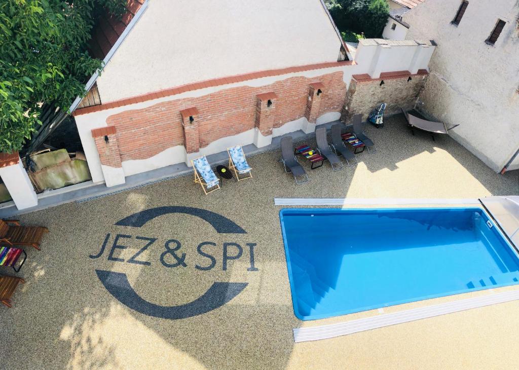 an aerial view of a building with a swimming pool at JEZ&SPI Plánice in Plánice