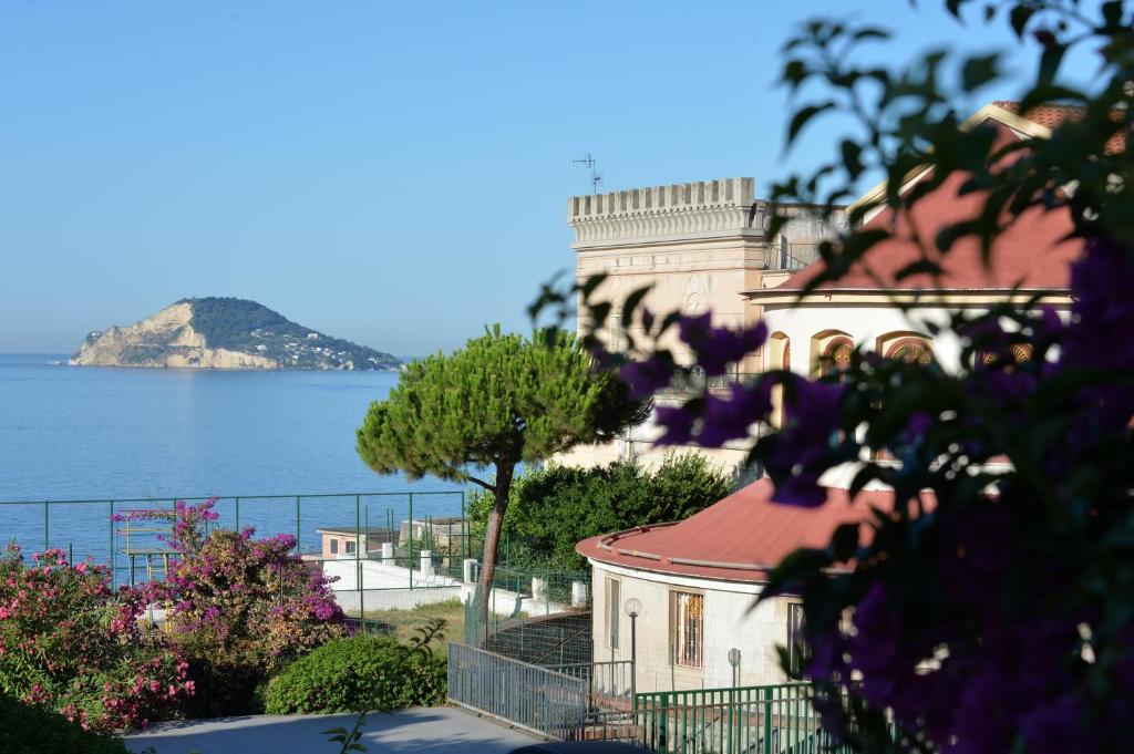 a building with a view of the water at Miramare Residence in Pozzuoli