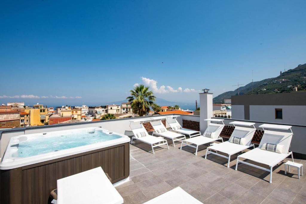 a hot tub on the roof of a building at DON GIULIO LUXURY ROOMS jacuzzi in Vico Equense