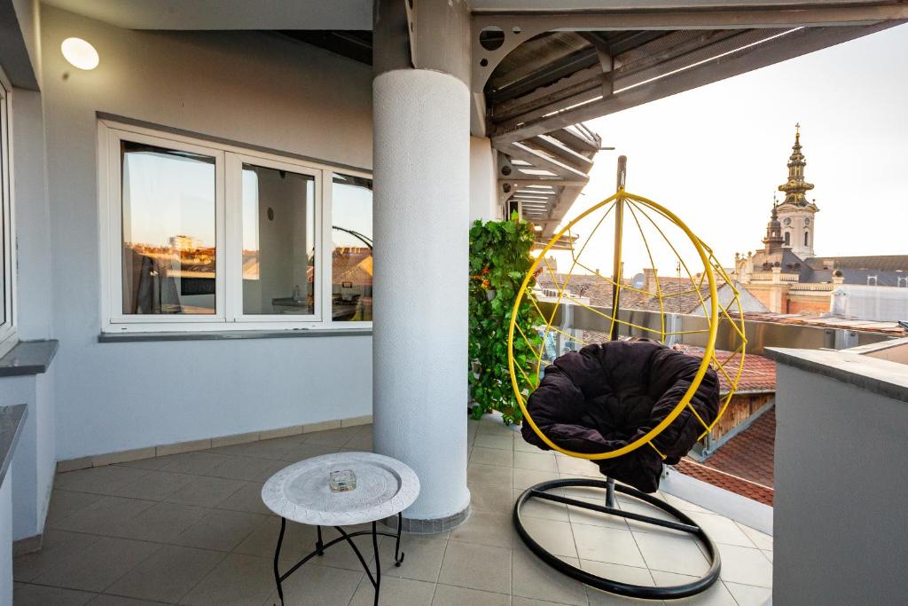a balcony with a view of a city at Urban Chic in Novi Sad