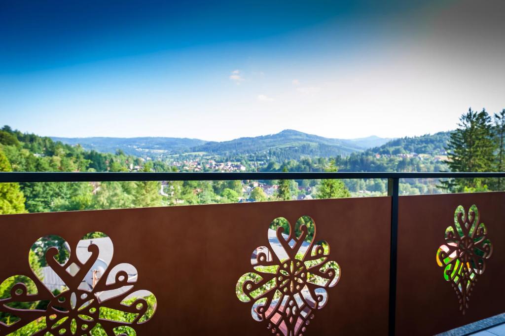 a balcony with a view of the mountains at Villa Brody in Wisła