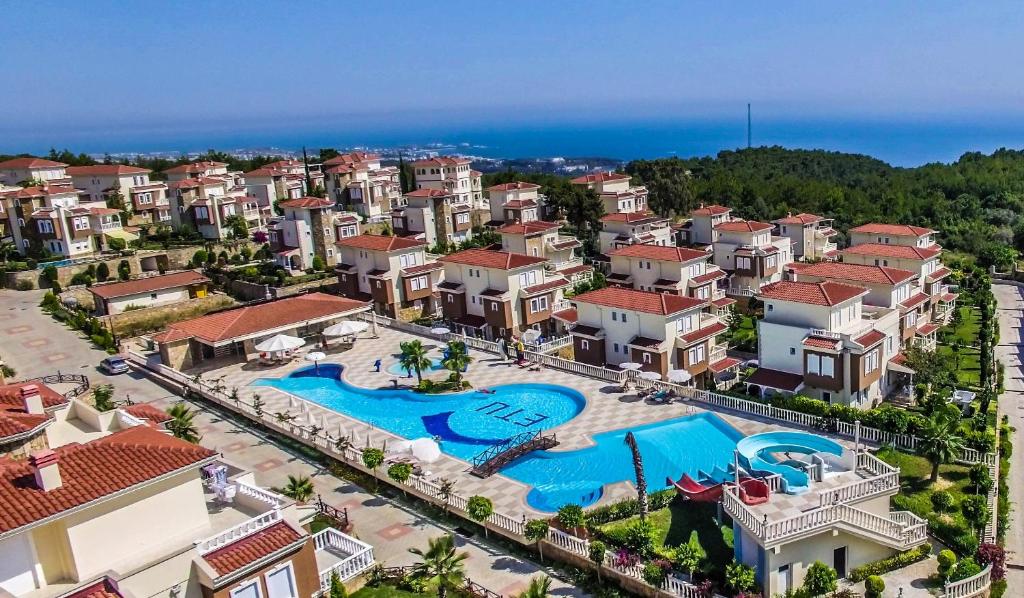 an aerial view of a resort with a swimming pool at Ottoman Village in Alanya