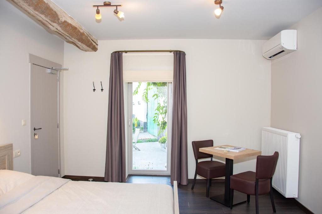 Postel nebo postele na pokoji v ubytování B&B De Oude Winning