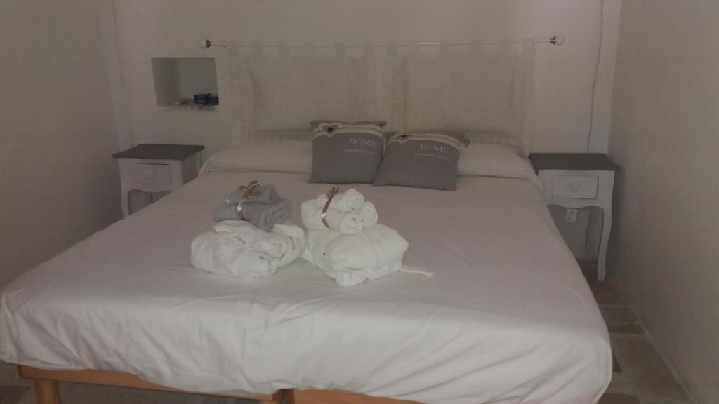 Postel nebo postele na pokoji v ubytování Concita's Trulli
