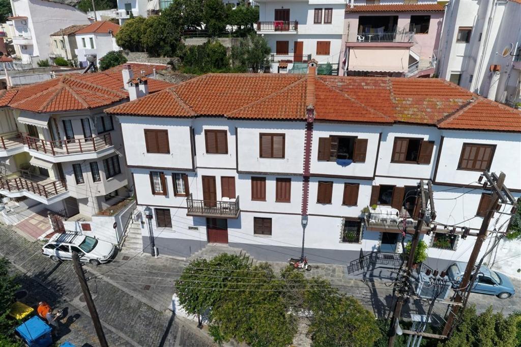 an overhead view of a white house with red roofs at Kavala Rooms in Kavála