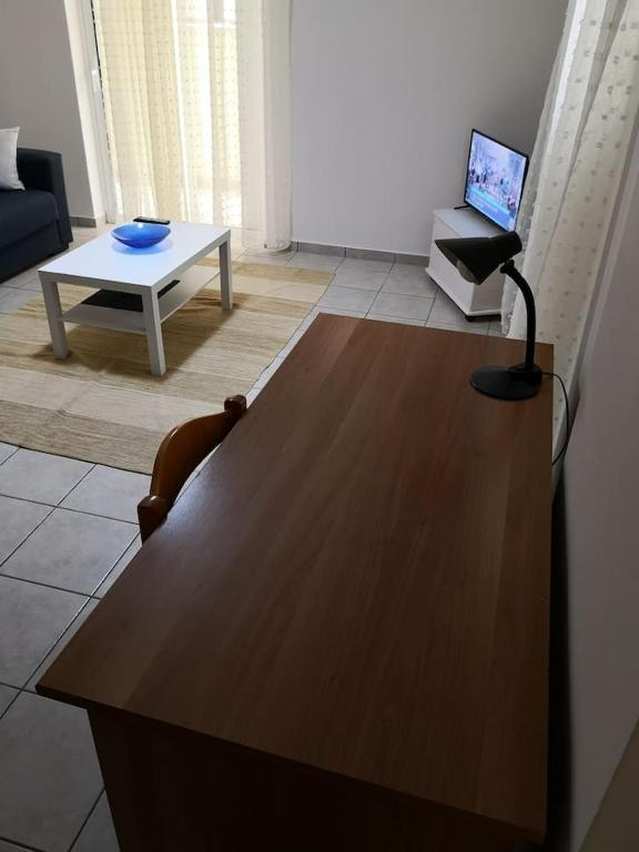 Televízia a/alebo spoločenská miestnosť v ubytovaní Riohome
