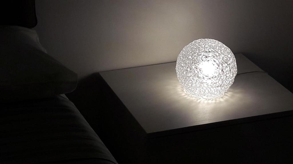 a chandelier on a table in a dark room at Residenza Leonarda in Vado Ligure