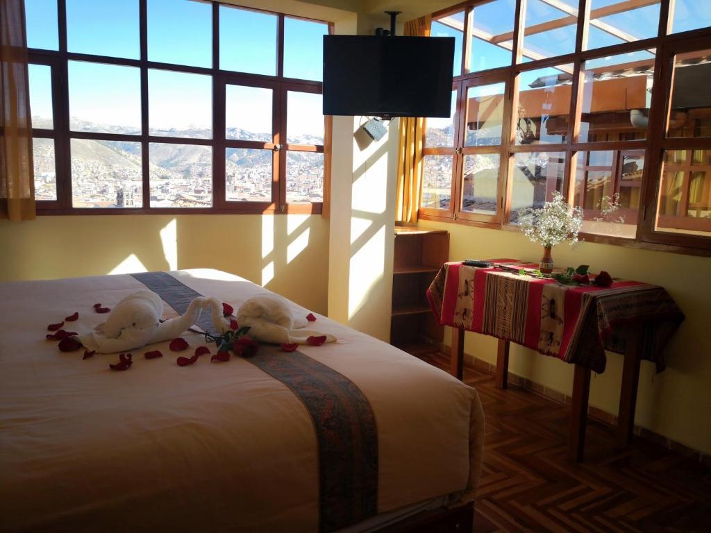 Ένα ή περισσότερα κρεβάτια σε δωμάτιο στο Kuska Hostal