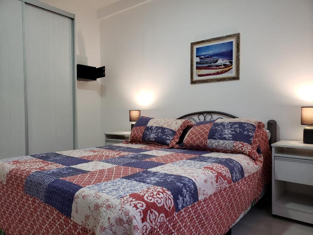 Voodi või voodid majutusasutuse Departamentos Temporarios Reggiardo toas