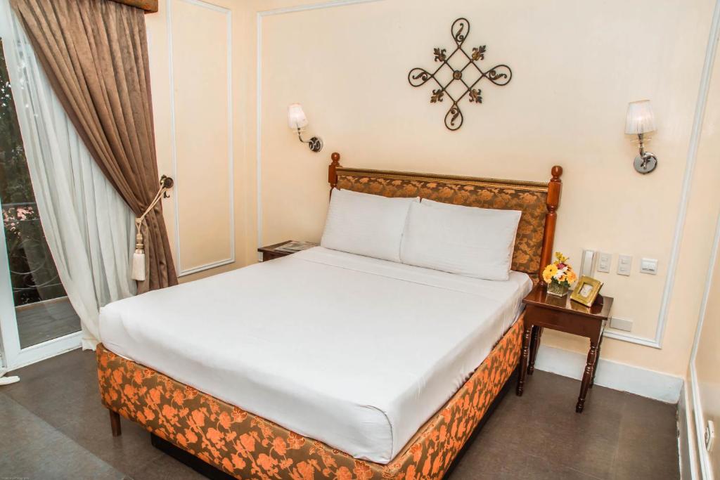 Postel nebo postele na pokoji v ubytování Viewpark Hotel Tagaytay