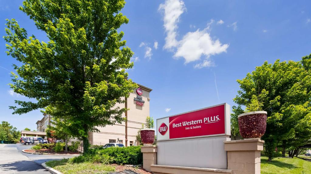 a sign for a hotel in front of a building at Best Western PLUS Hannaford Inn & Suites in Cincinnati