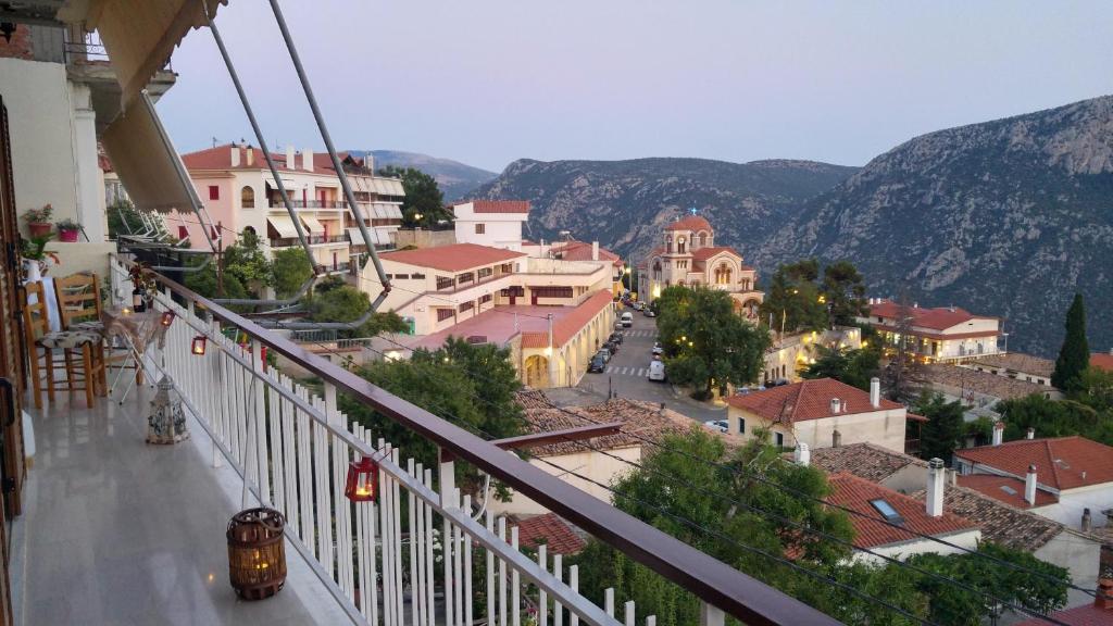 a view of a town from the balcony of a building at Delphic Horizons in Delphi