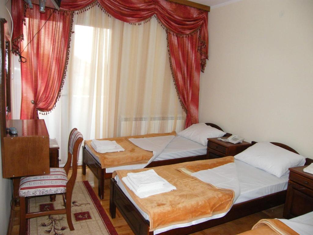 Postel nebo postele na pokoji v ubytování Hotel Delta