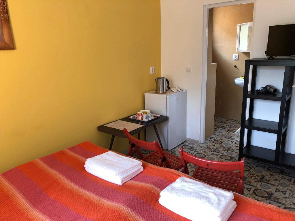 Postel nebo postele na pokoji v ubytování Apartmány LETO