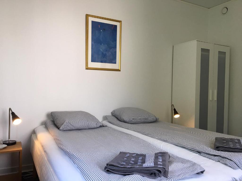 Postel nebo postele na pokoji v ubytování Vitaby Järnvägshotell