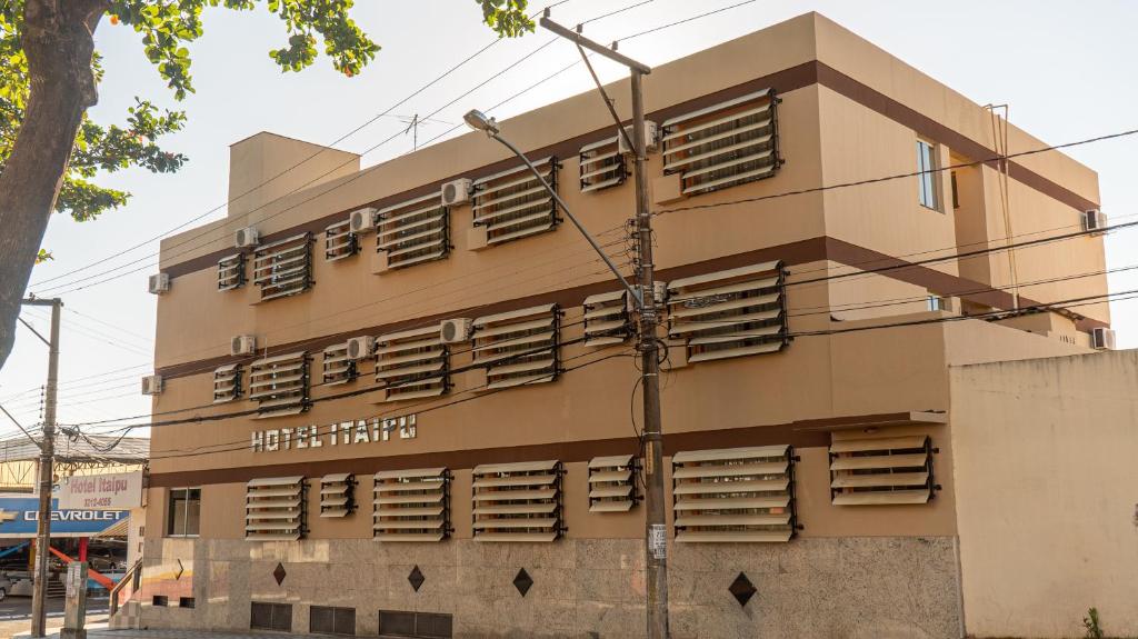 a building with shutters on the side of it at Hotel Itaipu in Goiânia