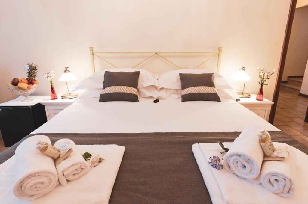 Postel nebo postele na pokoji v ubytování Albergo Giardino