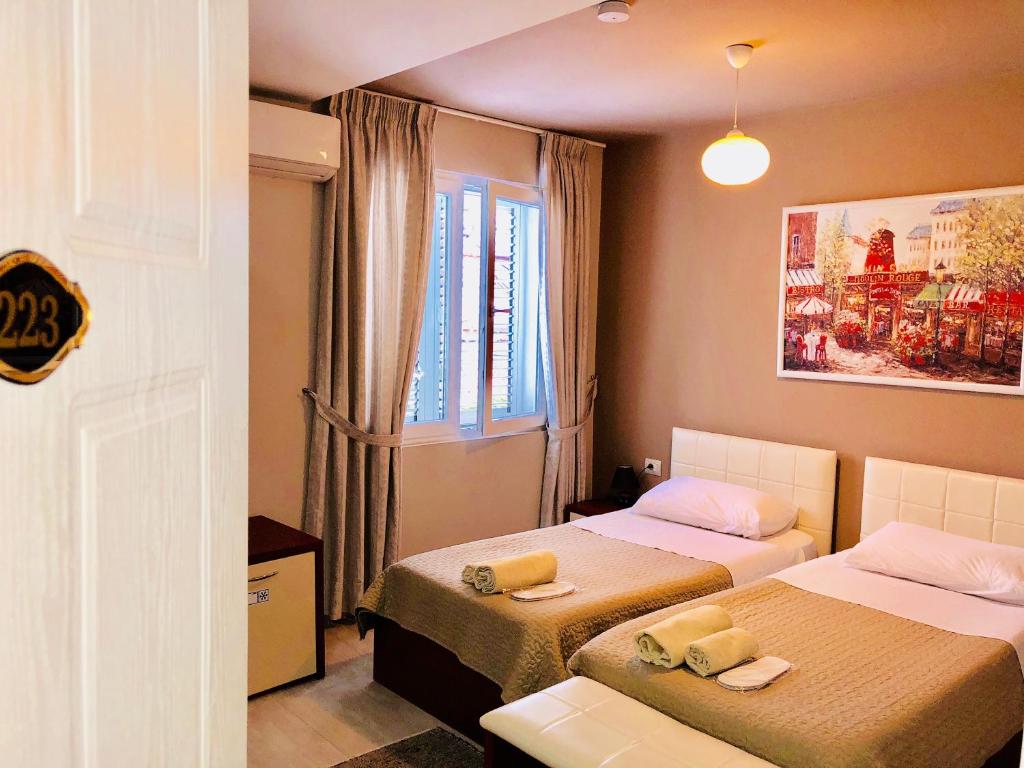 Postel nebo postele na pokoji v ubytování Vila Ada Hotel