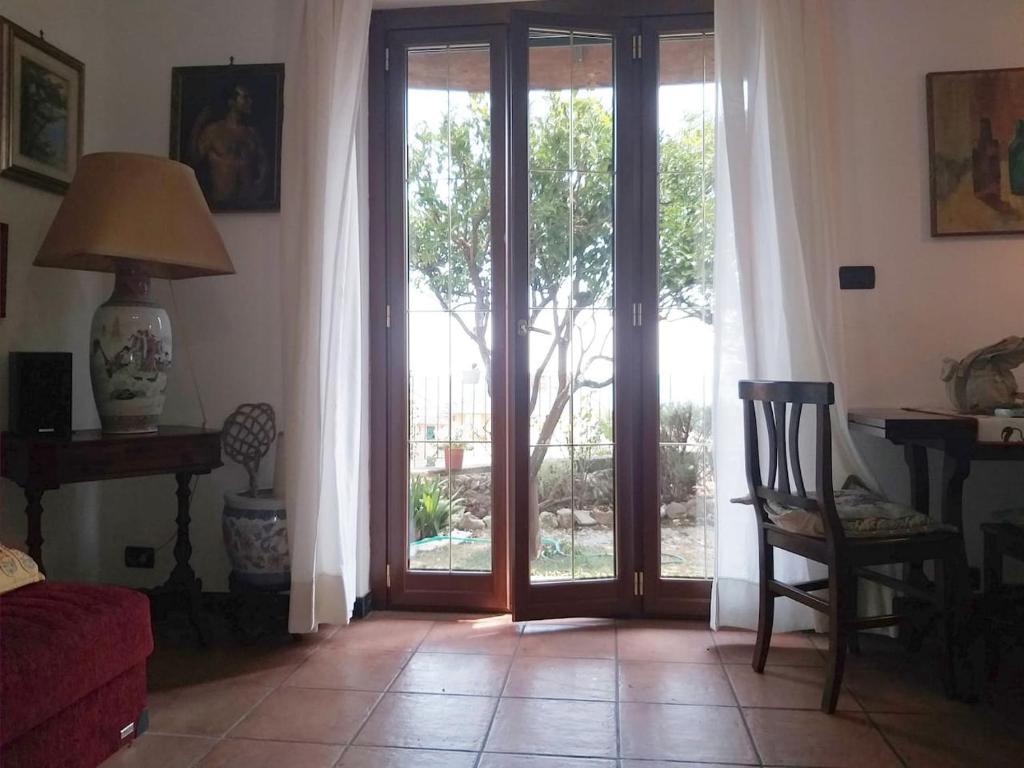 a living room with a sliding glass door at Il giardino di Peo in Bogliasco