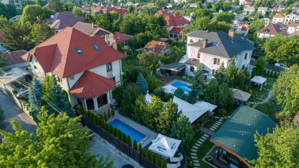 an aerial view of a house with a swimming pool at Diplomat Club Hotel in Chişinău