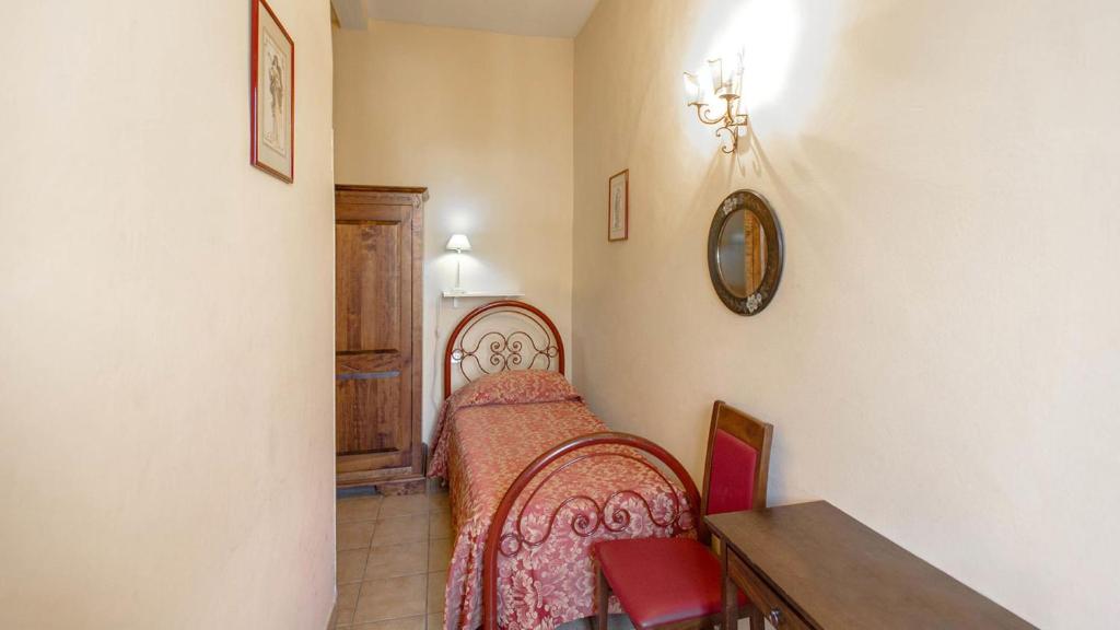 Postel nebo postele na pokoji v ubytování Hotel Masaccio