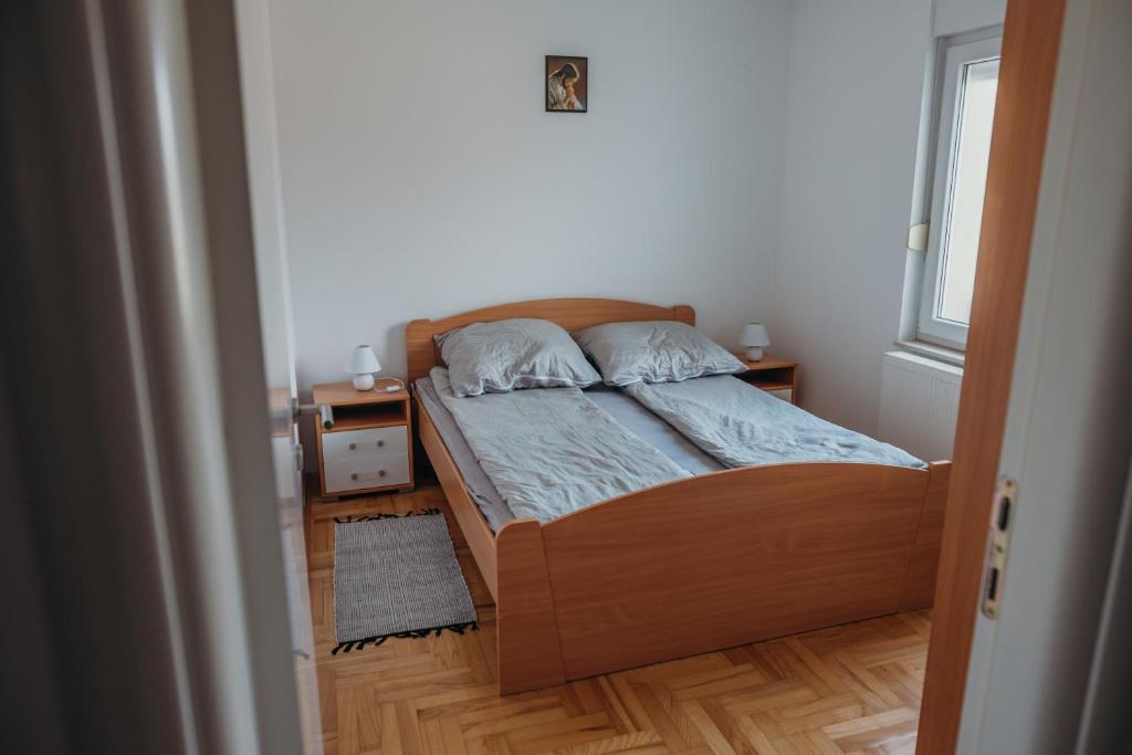 Postel nebo postele na pokoji v ubytování Apartman "JOKA"