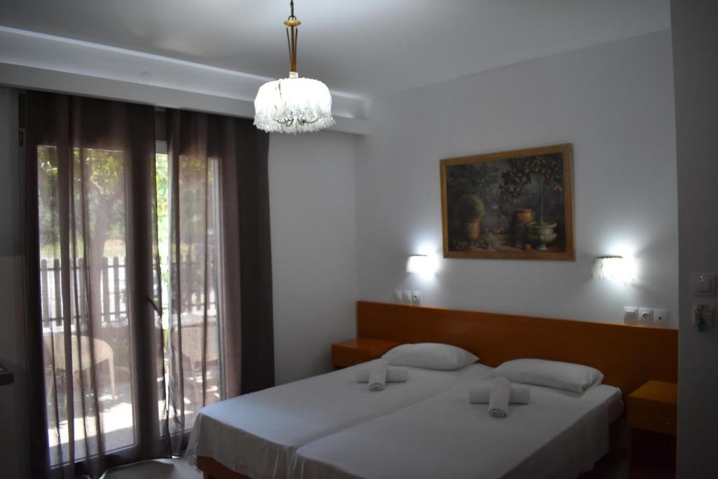 Postel nebo postele na pokoji v ubytování Hotel Ritsa